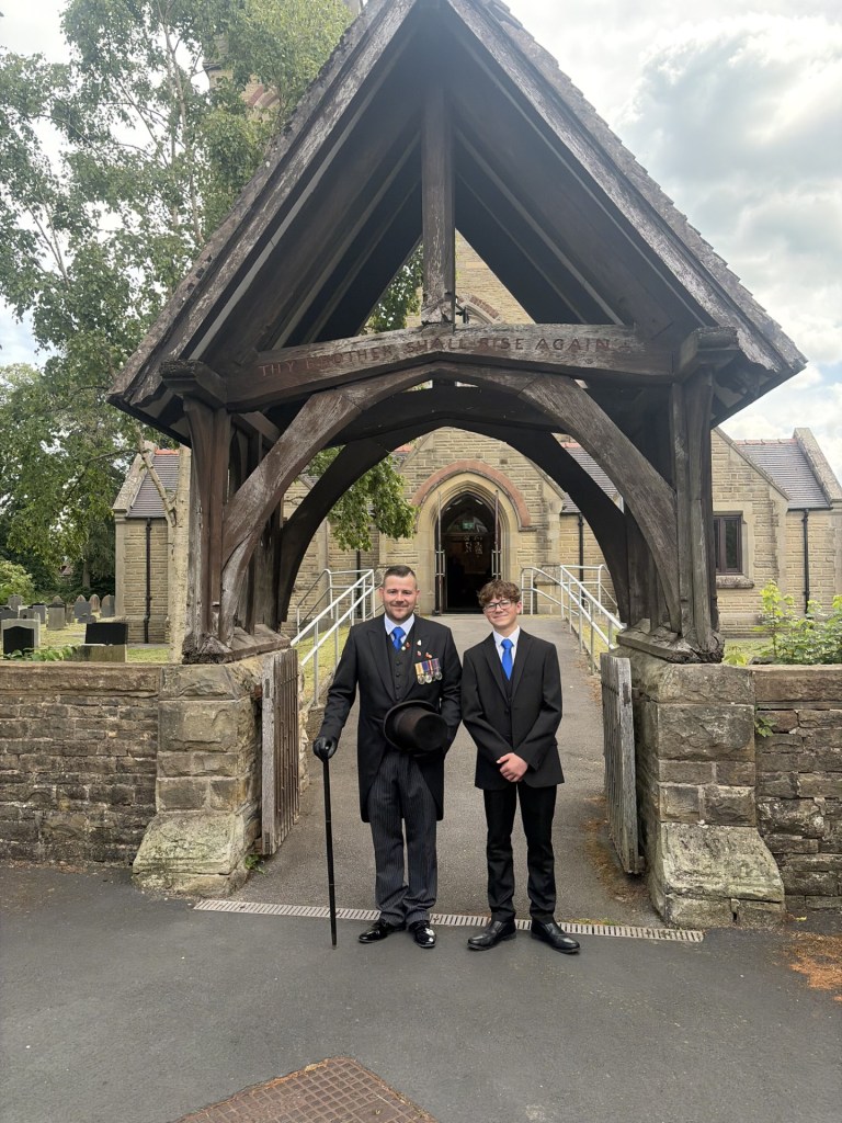 Rob and Ben outside a local church
